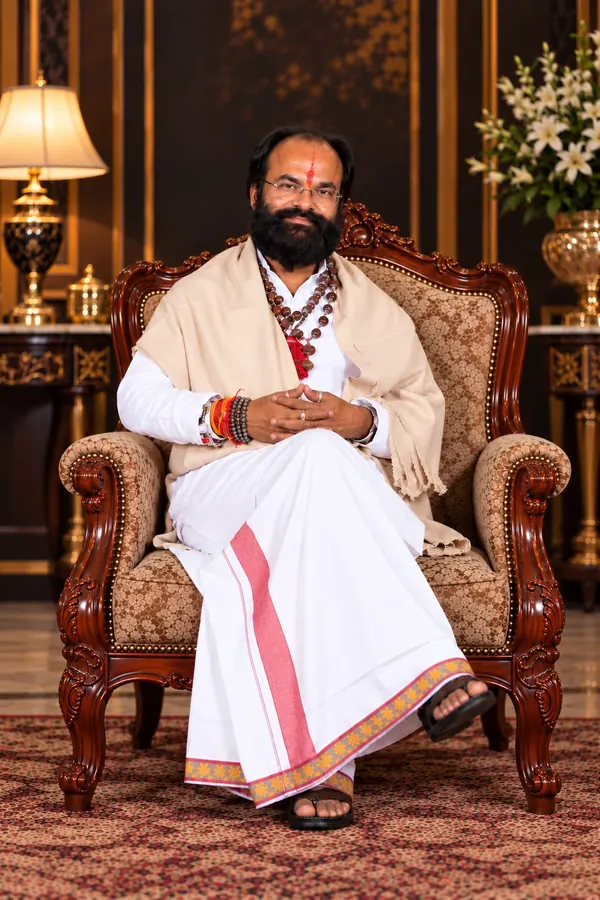 Sadguru Jai Ji Maharaj, Peethadhishwar, in a white dhoti and shawl with rudraksha mala
