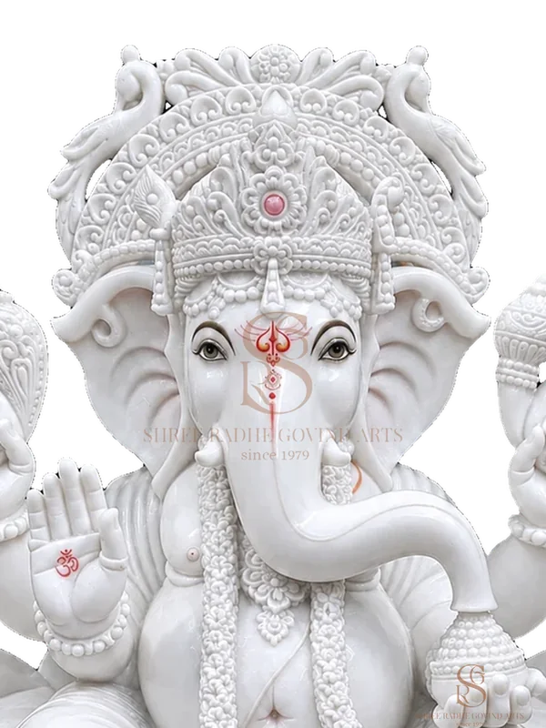Close-up of the face and crown of the Ganesh ji on Lotus