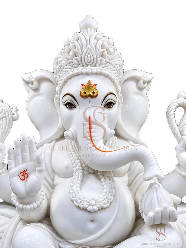 Close-up of the face and crown of the Ganesh ji on Singhasan