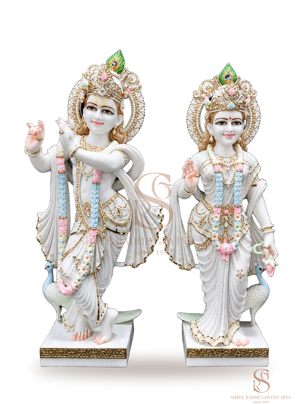 Radha Krishna standing pair in white marble, painted in pastel colours with gold work